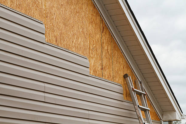 Professional Storm Damage Siding Repair technician working in New London, CT
